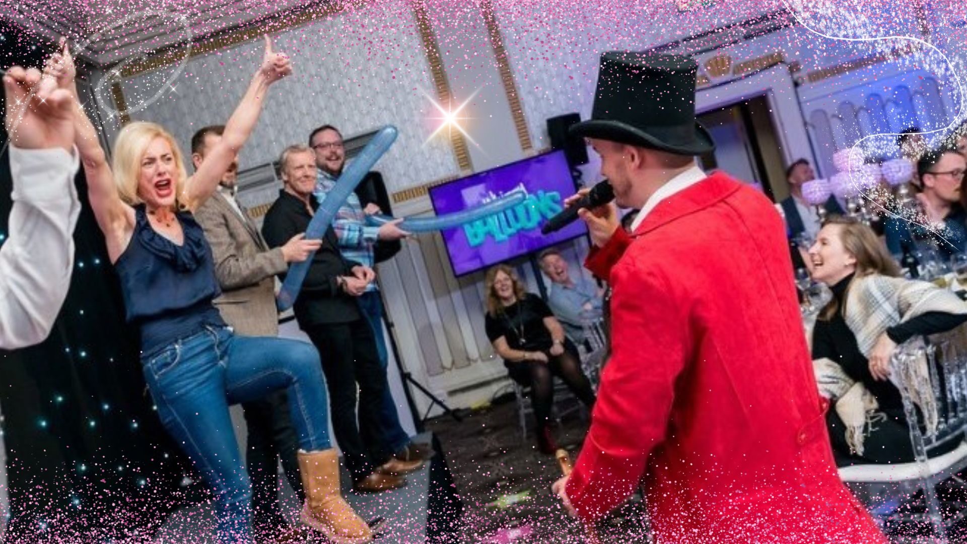 The Greatest Game-Showman on stage as confetti rains down on cheering guests